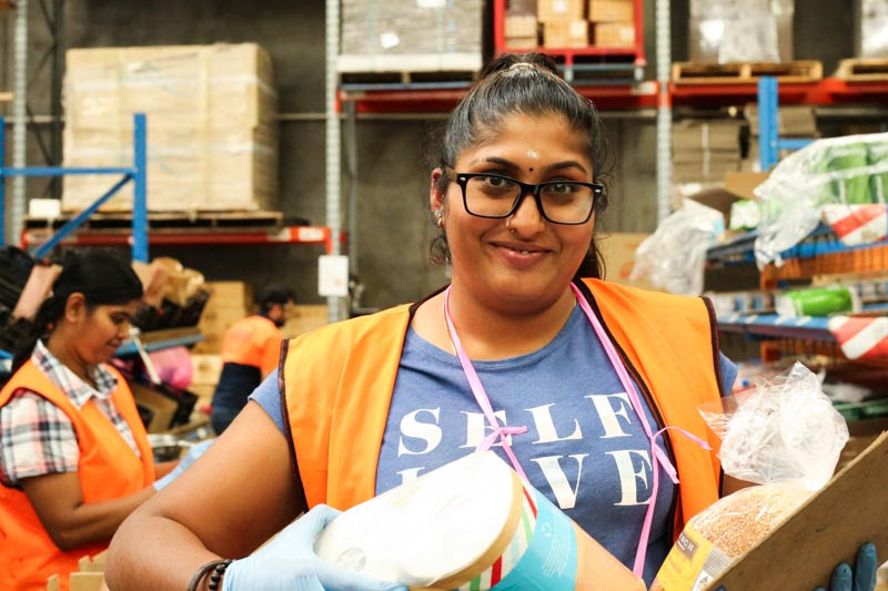 Nicky packing orders in the Fair Food warehouse