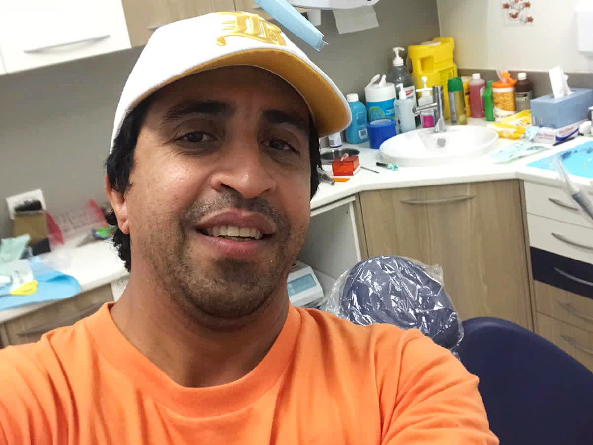Mohammad with new teeth at the dentist