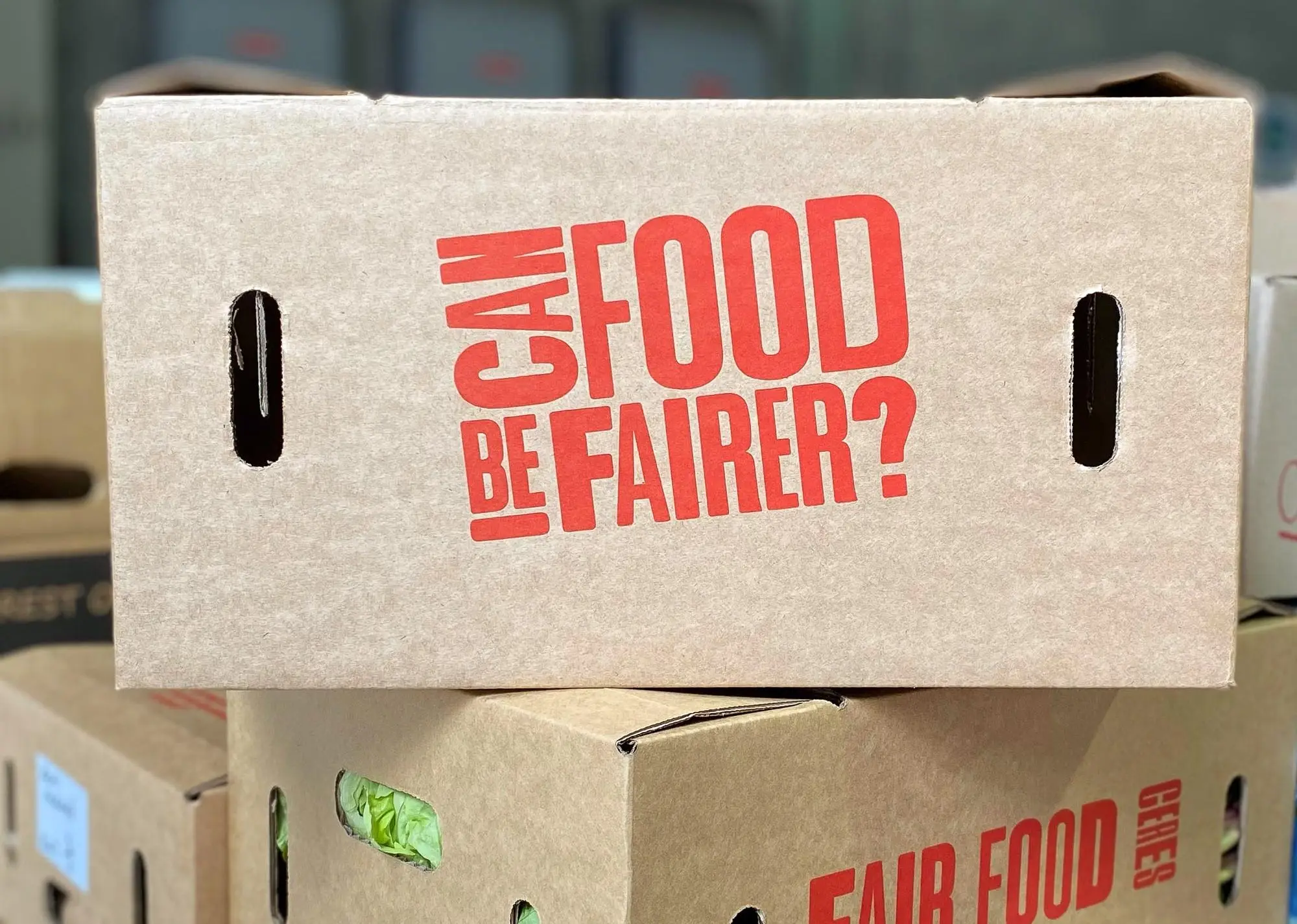 Stack of Fair Food boxes ready to go into the delivery van.