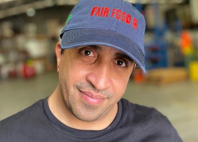 Mo, CERES Fair Food warehouse supervisor, modelling new hat
