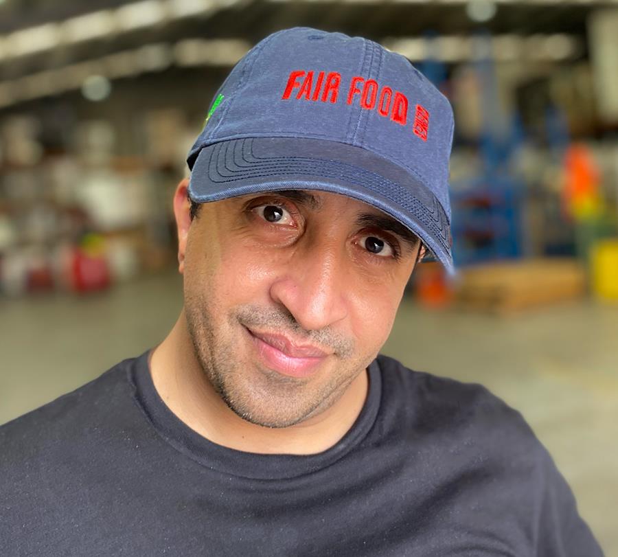 Mo, CERES Fair Food warehouse supervisor, modelling new hat 