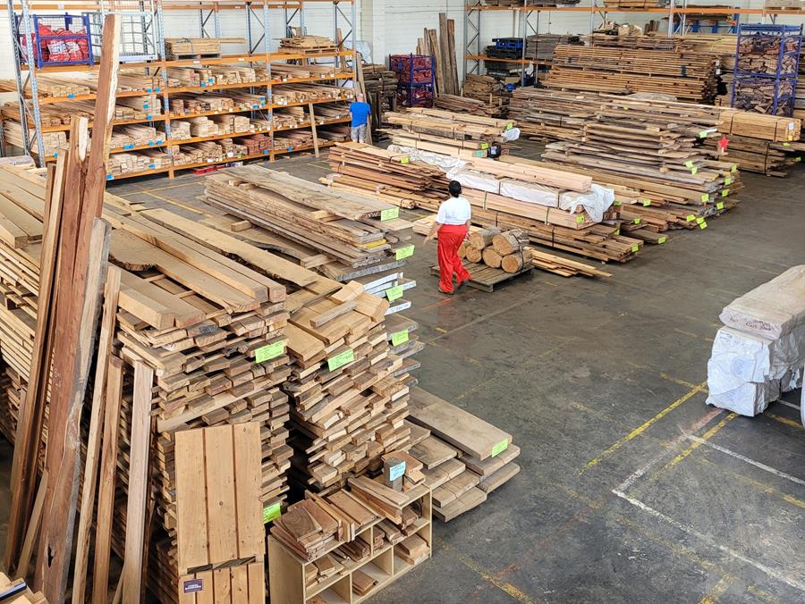 FairWoodWarehouse-2 - CERES Fair Food CERES Fair Wood warehouse, Preston - timber stacked in piles for sale.