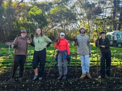 Screenshot - CERES Fair Food Volunteers with their weeding tools at Joe's Market Garden, Coburg
